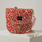 Mongoose Pom Pom Bag in Leopard Spots Red-Natural